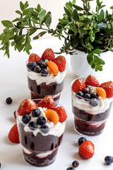 Beautiful cupcakes on white background at home with flowers. Festive cake for the birthday. 