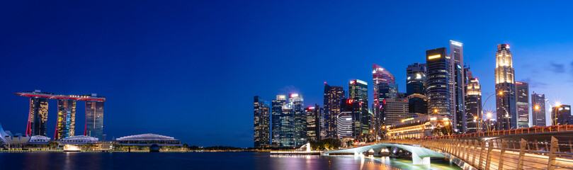 Fototapeta na wymiar Ultra wide panorama of Cityscape of Singapore Marina bay area at dusk.