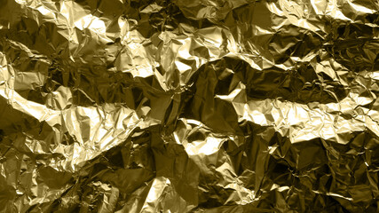 gold foil background with shiny crumpled surface for texture background