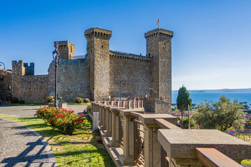 Bolsena, Italy - The old town of Bolsena on the namesake lake. An italian visit in the medieval historic center and at the port. Here in particular The Castle Rocca Monaldeschi of Cervara - obrazy, fototapety, plakaty