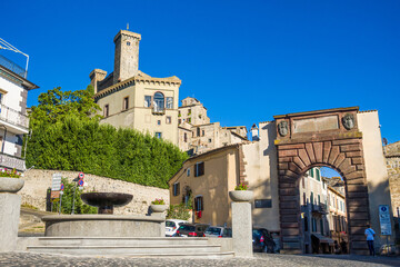Bolsena, Italy - The old town of Bolsena on the namesake lake. An italian visit in the medieval historic center and at the port. Here in particular the gate of the old town and the castle.