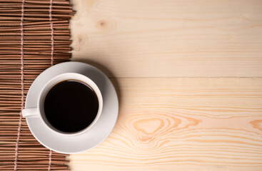 warm cup of coffee on brown background