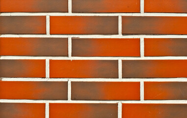 Texture of brick wall. new brickwork. Samples of wall or fence are presented at exhibitions. Orange brick close up.