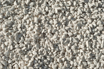 Drainage systems from small pebbles. Garden drainage for plants and trees. White stones for roads and flower beds.