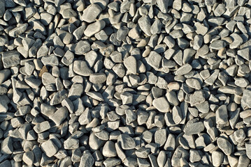 Drainage systems from small pebbles. Garden drainage for plants and trees. Gray stones for roads and flower beds.