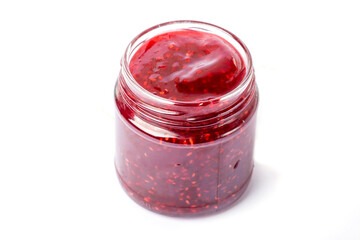 raspberry jam in a glass jar on a white background