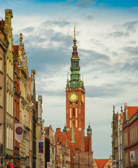 Spire of Gdansk Main Town Hall on background of summer cityscape, Poland 