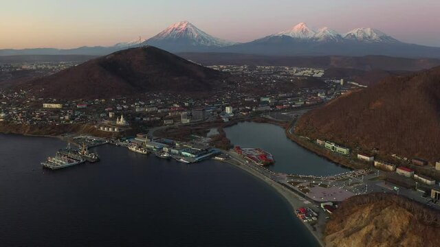 Beautiful seaports on Russia's Kamchatka Peninsula and the stunning Koryaksky and Avachinsky volcanoes. Beautiful Petropavlovsk cityscape.