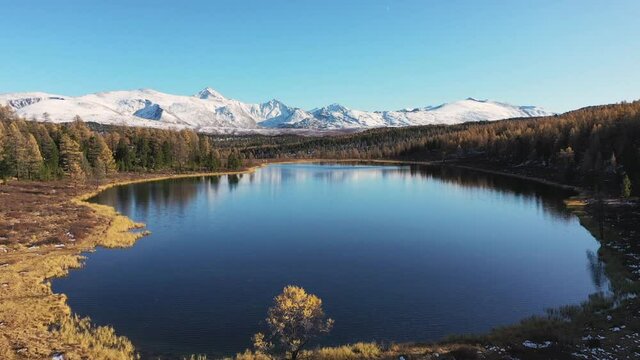 The natural scenery of autumn forests, snow-capped mountains and lakes. Russia&rsquo;s most popular travel destination is located in the Altai Mountains of Siberia, Russia.