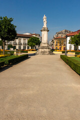 Fototapeta na wymiar Urban Square With Statue, Greenery and Buildings, Braga, Portugal
