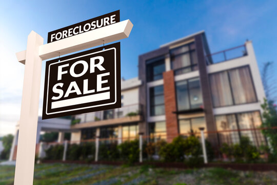 Black Foreclosure Home For Sale Real Estate Sign in front of a contemporary glassy modern house.