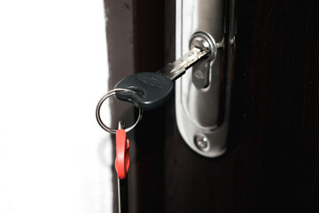 Bunch of keys in a door lock close up