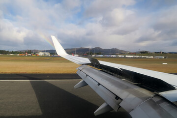 Thrust reversal at Hobart Airport with rainbow in the background. Tasmania, Australia. June 30, 2019.