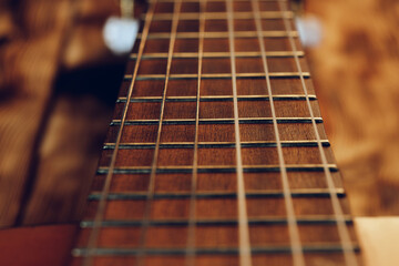 Guitar fingerboard with strings close up photo