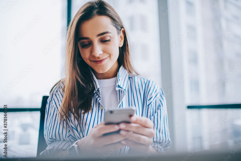 Aufkleber pretty caucasian blogger checking smartphone notification for installing application, millennial gen