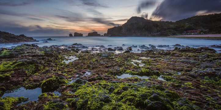 Siung beach landscape high resolution view in long exposure shot with motion blur cloud background