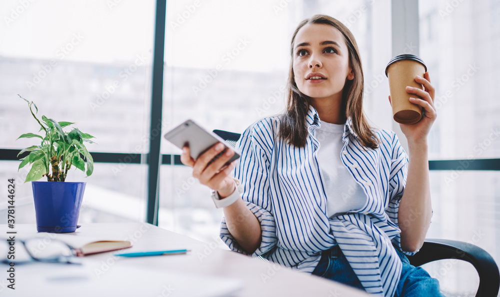 Poster pensive caucasian employee in smart casual clothing using cellular application for social networking