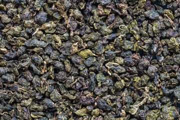 Green tea leaves background and texture, macro shot