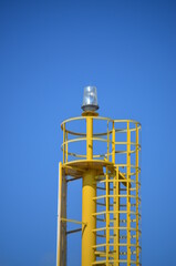 
signaling beacon with yellow steel supporting structure
