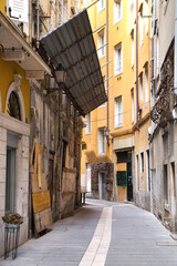 Old architecture and narrow street of historic Trieste, Italy
