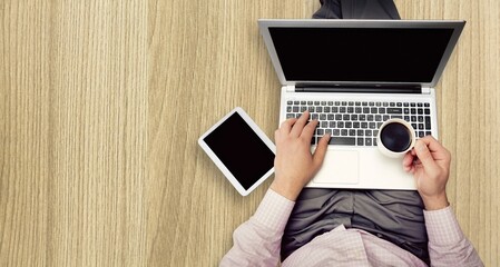Top view of a businessman using laptop computer