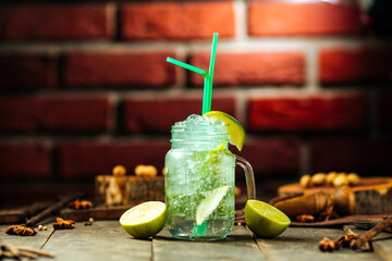 Lime lemonade in a glass mug with brick wall