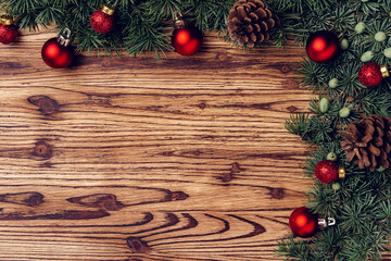 Christmas background with decorations on brown wooden board