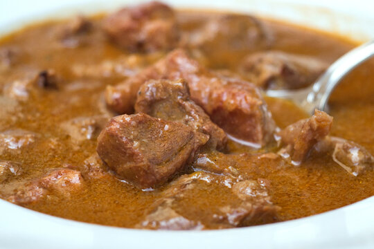Traditional Croatian rustic meat dish - venison gulash with rich berry and mushroom sauce 