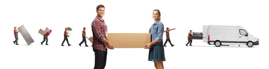 Young man and woman carrying a box and movers with a van in the back