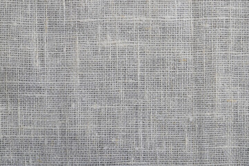 handmade fabric made of linen and cotton fibers of plain weave, beige background, macro