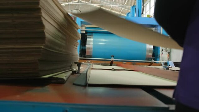 A Process of card board production printing which feed in to roller machinery printer.