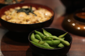 Close up of a bowl of delicious edamame (green bean), soft focus