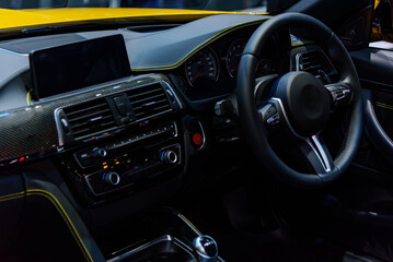 interior luxury of modern car with Black leather steering wheel