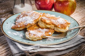Homemade pancakes on a wooden table.