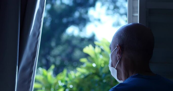 Man With Mask Looking Out The Window, Opening Curtains, Senior, Covid Coronavirus Pandemic