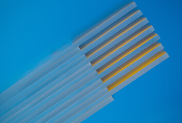 close up of glass plates yellow inn blue background