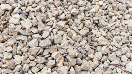 Top view of the Pebbles on the walkway.stone grit scree on floor.stone grit scree background.