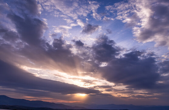 Colorfull sunset with a caotic sky and mountains - El Bierzo, Spain