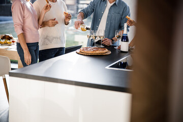 Mature male holding a bottle of wine