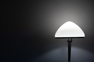Fototapeta na wymiar Bedside nightstand LED lamp isolated dark mood