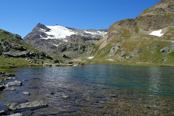 Colle del Nivolet, Italy: panorama with mountains and lake