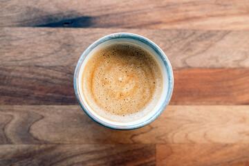 A cup of creamy coffe