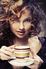 pretty young woman drinking coffee