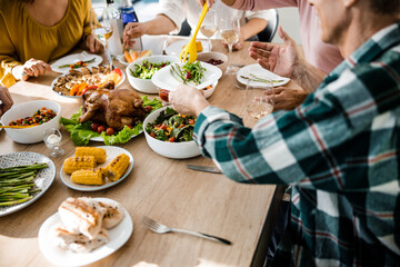 Man holding plate and sitting at the festive table