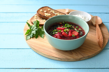 Traditional Ukrainian Russian vegetable soup, borsch with garlic donuts and bread