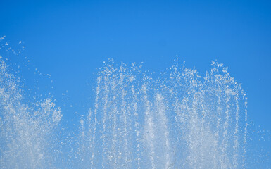 artesian fountain on blue sky