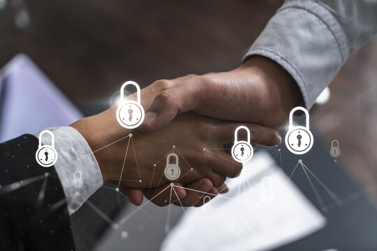 Multiexposure of two businesspeople handshake and lock icon hologram drawing background. Concept of internet business security information data. Formal wear. - Powered by Adobe