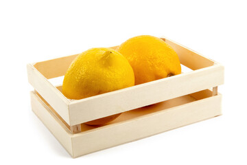 two yellow lemons in a small wooden crate