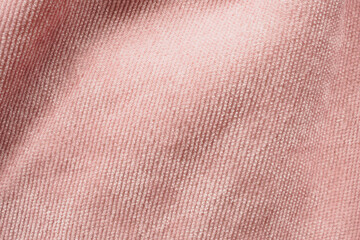 Fototapeta premium Pink fabric cloth texture background close up