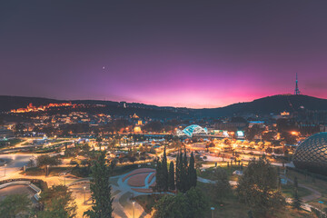 Fototapeta premium Tbilisi, Georgia. Modern Urban Night Cityscape. Evening Night Scenic View Of City Center